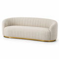 Sofá de 3 plazas en tela bouclé beige con base dorada